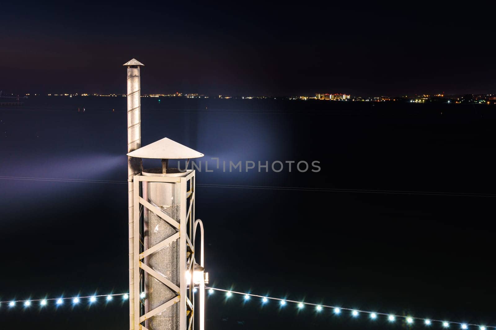 Smoke coming from the chimney, long exposure at night