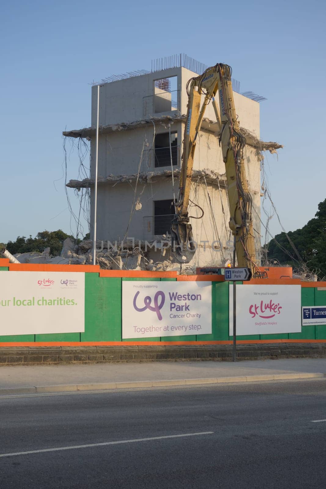 SHEFFIELD, UNITED KINGDOM, 17th September, 2020: High level demolition of sheffield university social sciences hub, using excavator concrete crusher