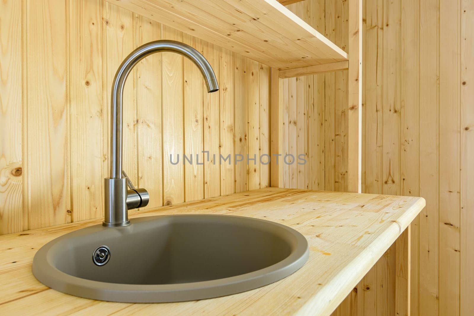 Kitchen set in a country house, natural wood worktop