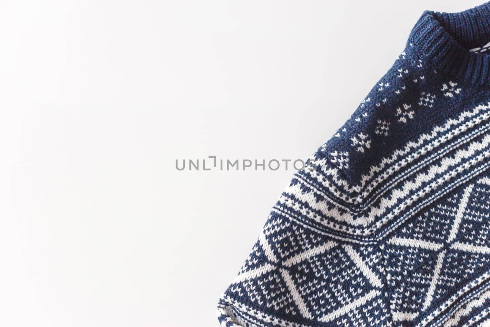 Wool man blue pullover with white pattern isolated at white background