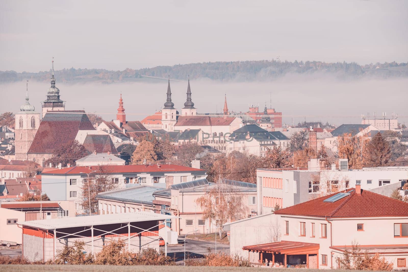 view of the city of Jihlava with Church of St. James the Greater. Autumn fall season with mist. Vysocina, Czech Republic