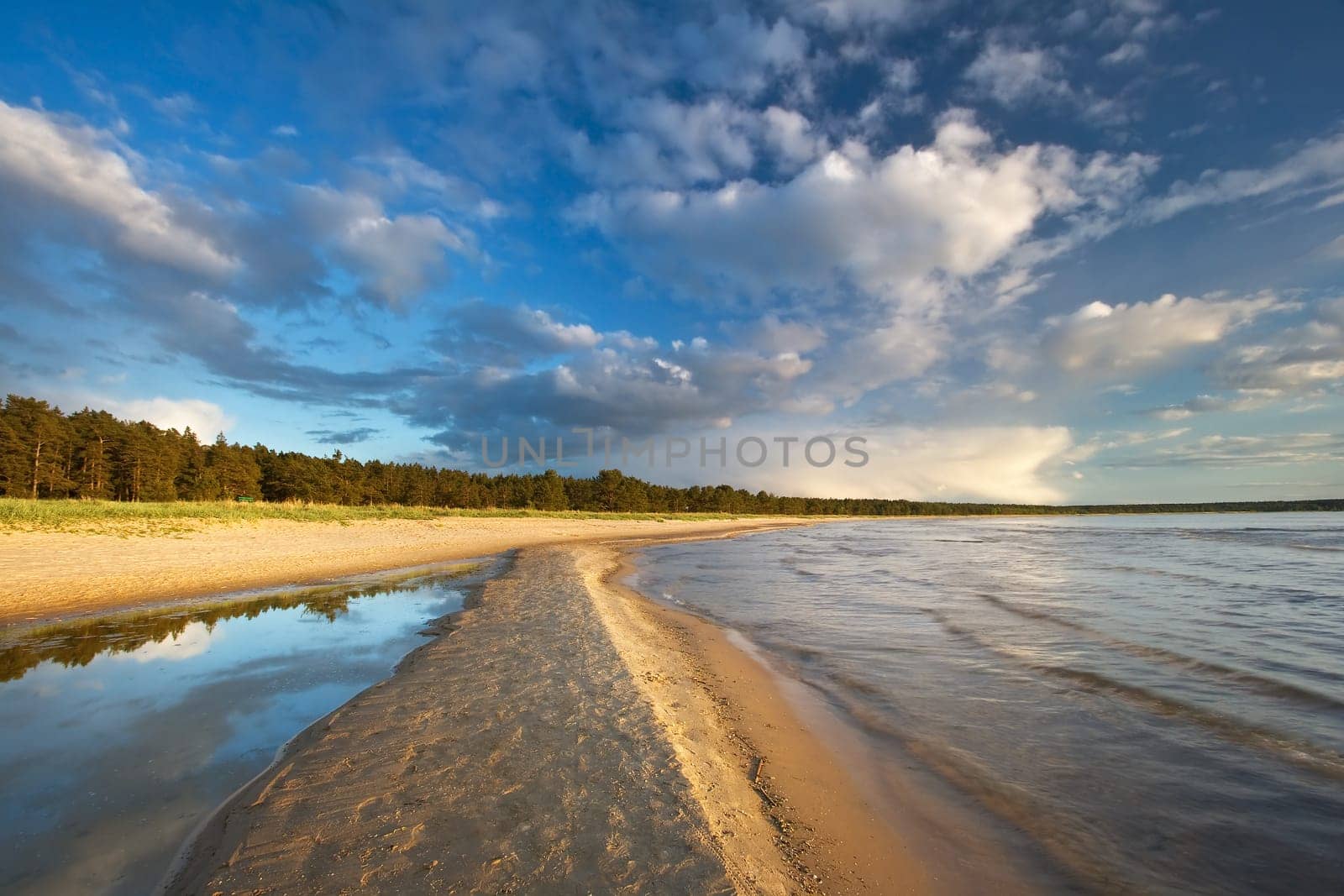 Path on the sea in evening light in summer