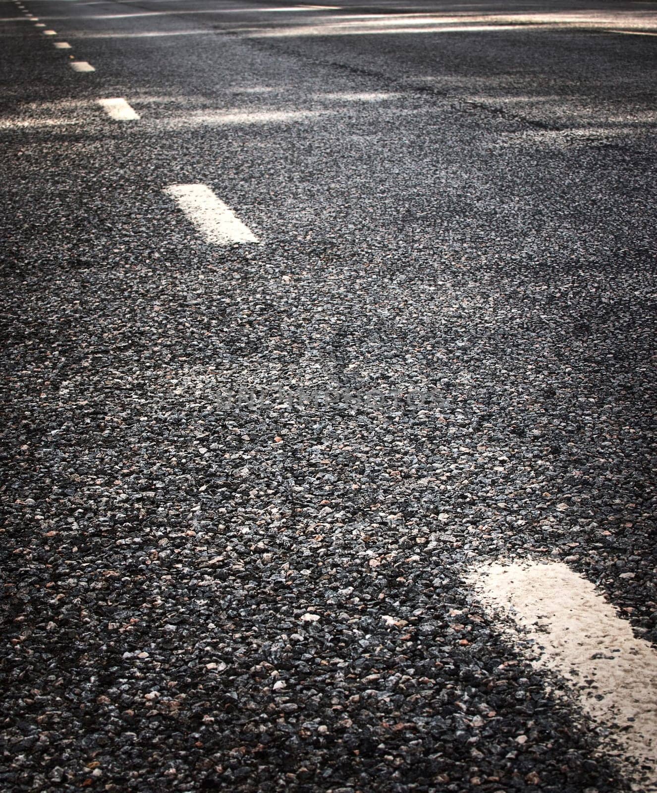 black asphalt road and white dividing lines