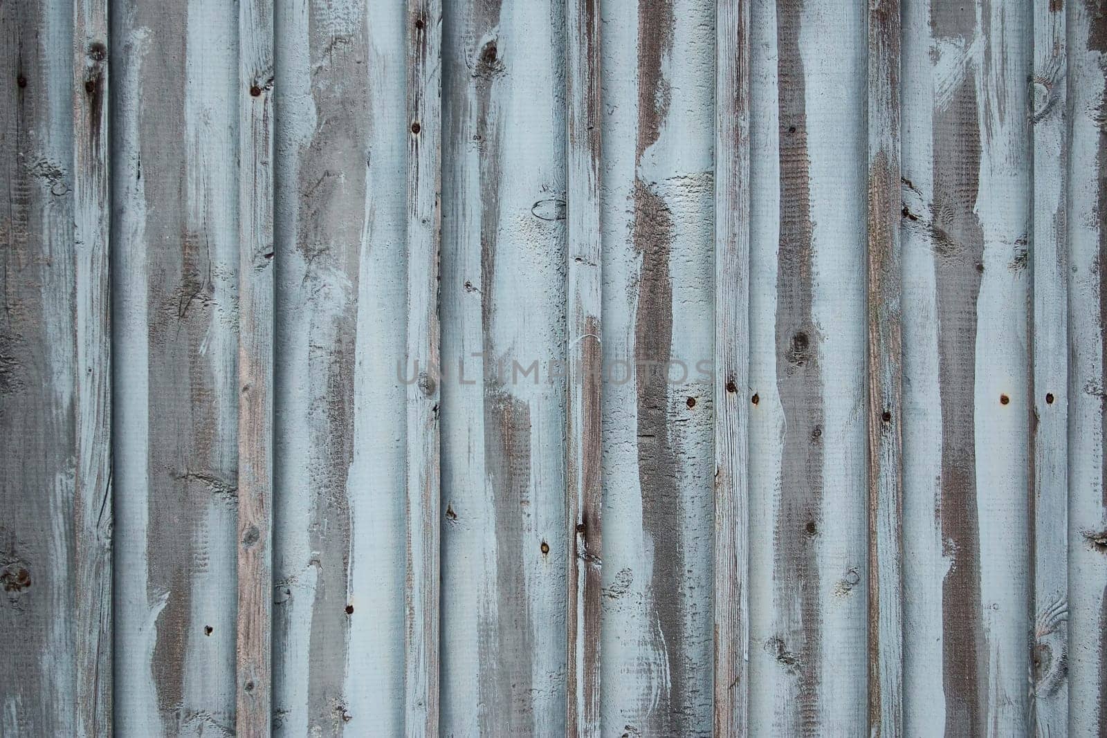 blue weathered wooden wall of an old building