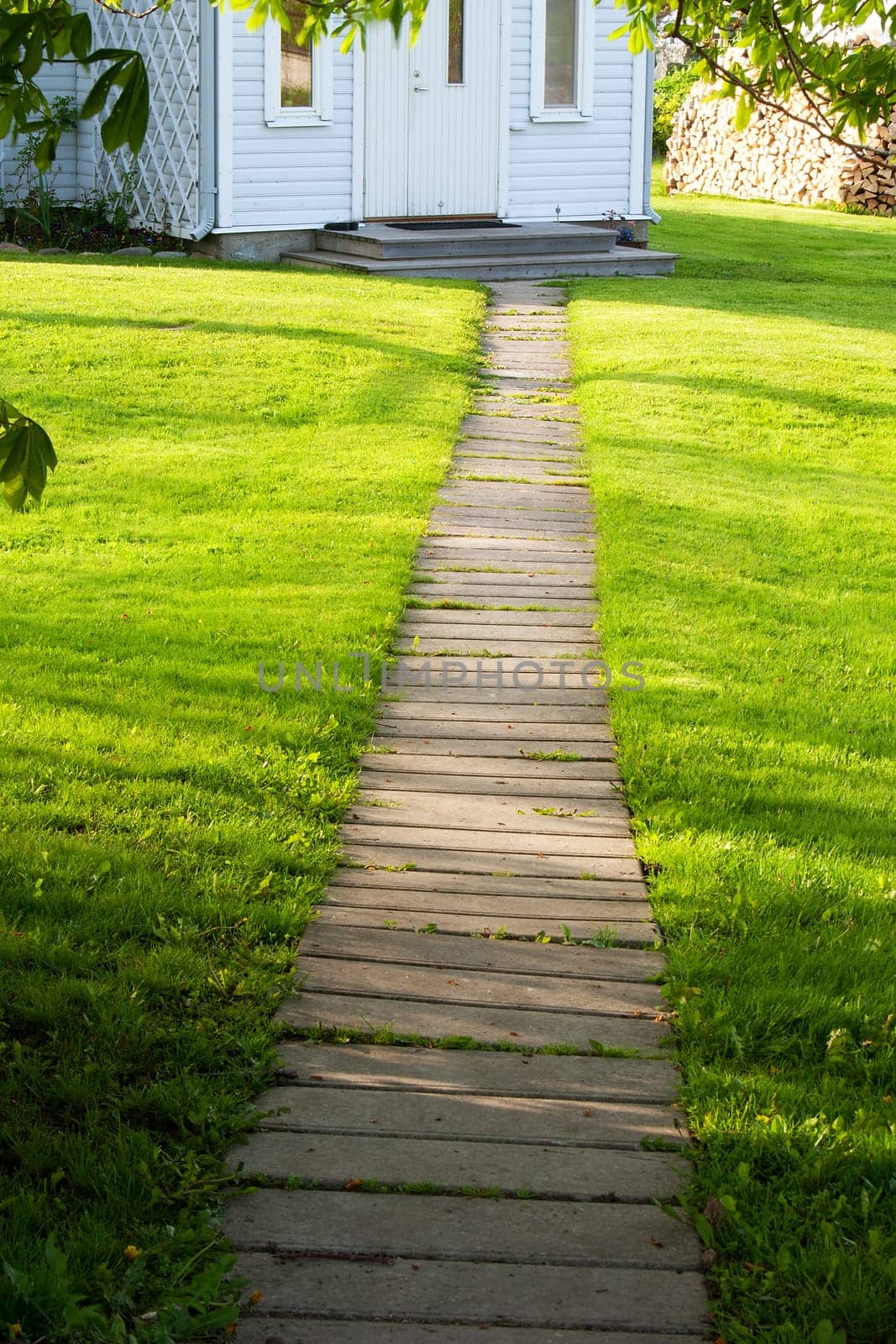 Footpath near a house with green lawn