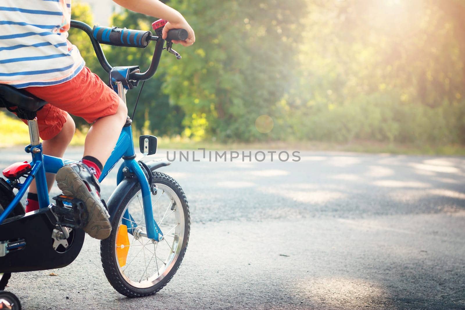 child on a bicycle at asphalt road