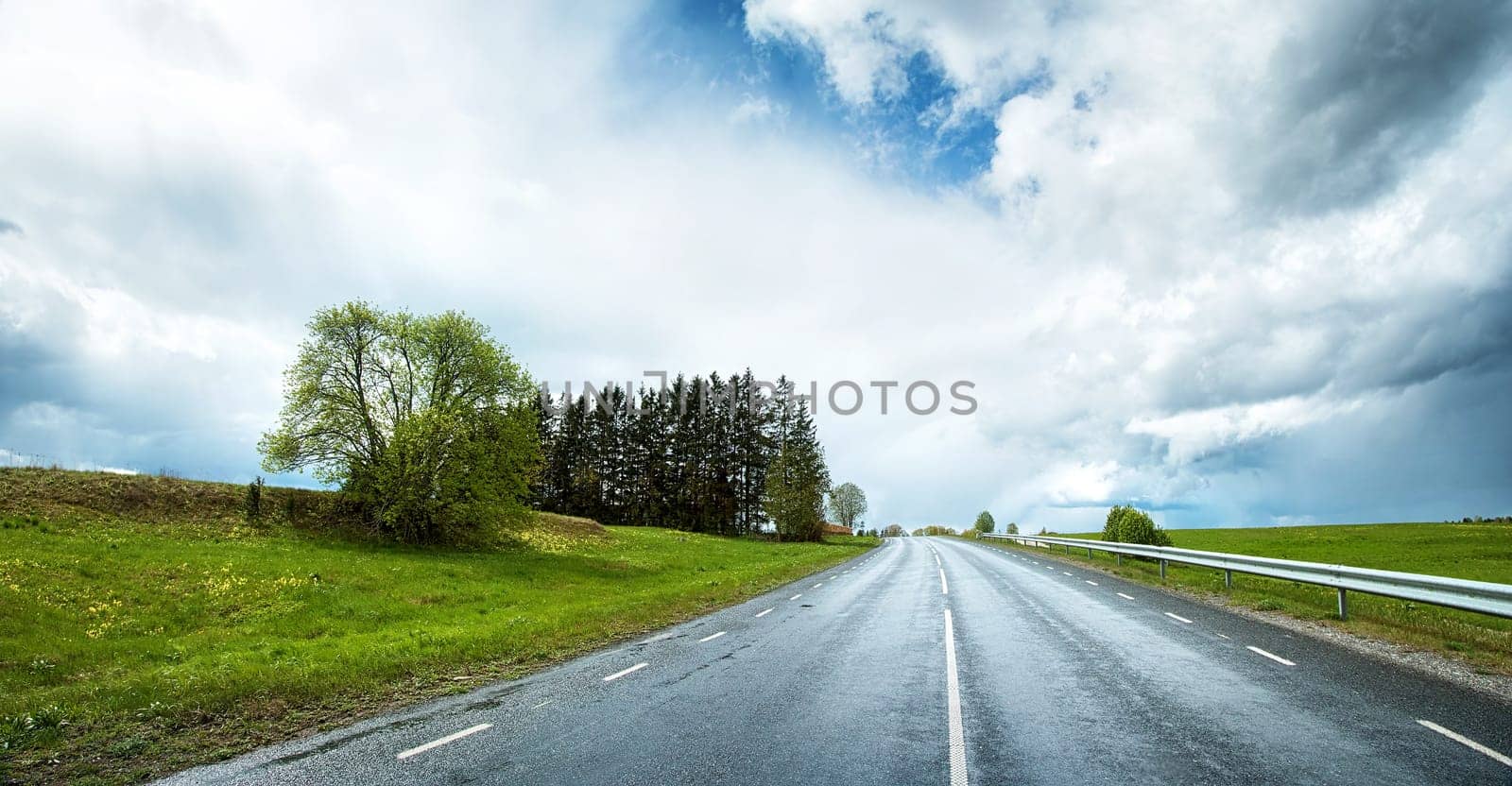 wet road panorama with beautiful clouds in the sky