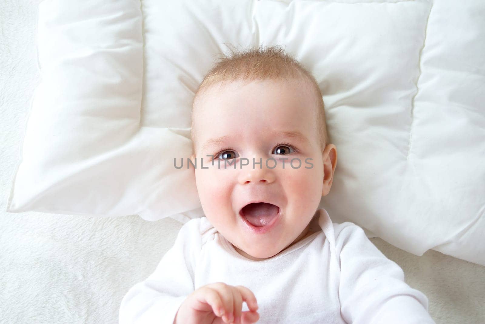 seven month old boy in the bed