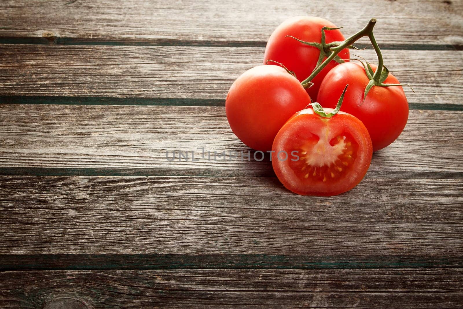 Fresh red potatoes on old wooden background