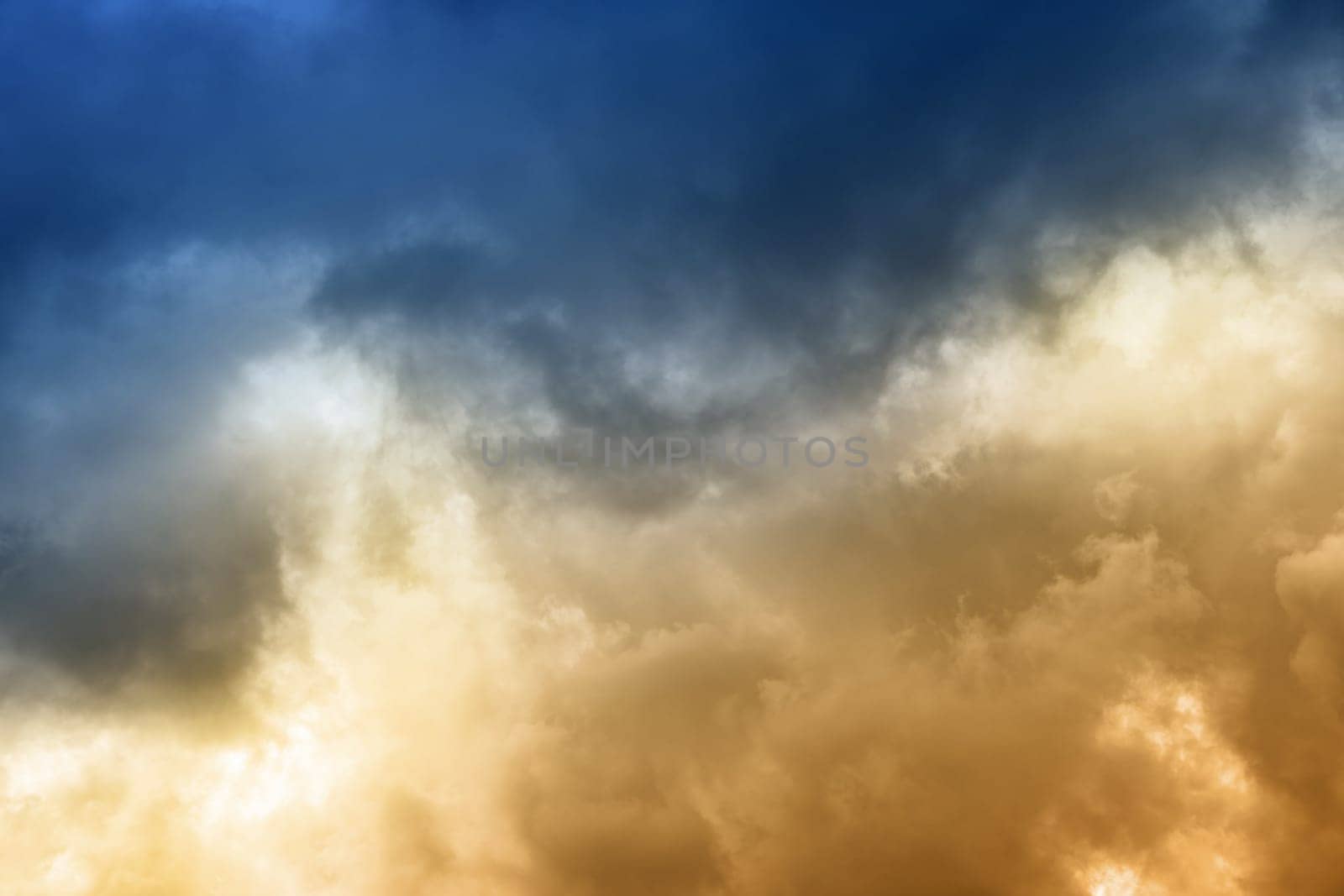 Dramatic clouds on the blue sky on sunny day