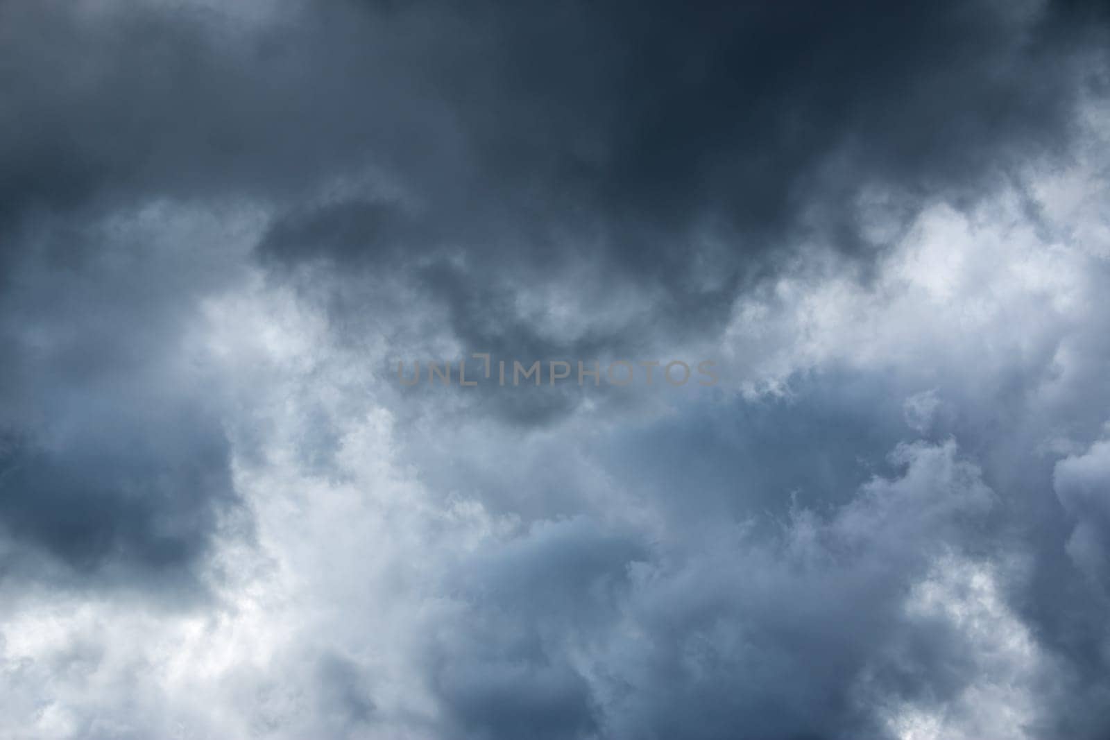 Dramatic clouds on the blue sky on sunny day