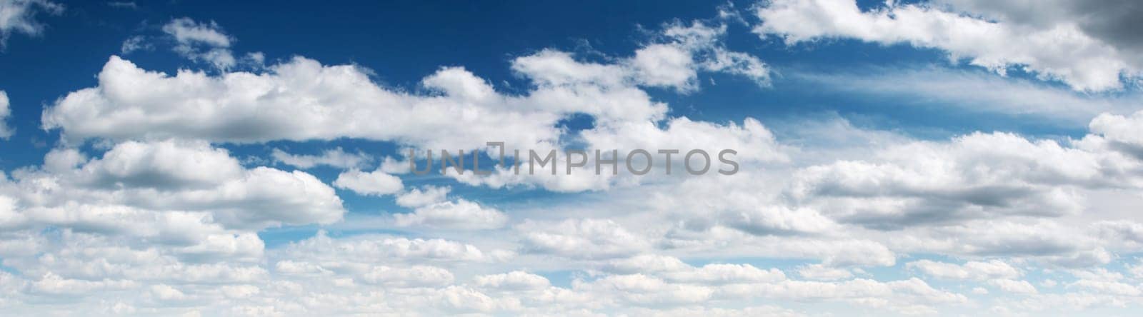 white clouds on the blue sky on sunny day