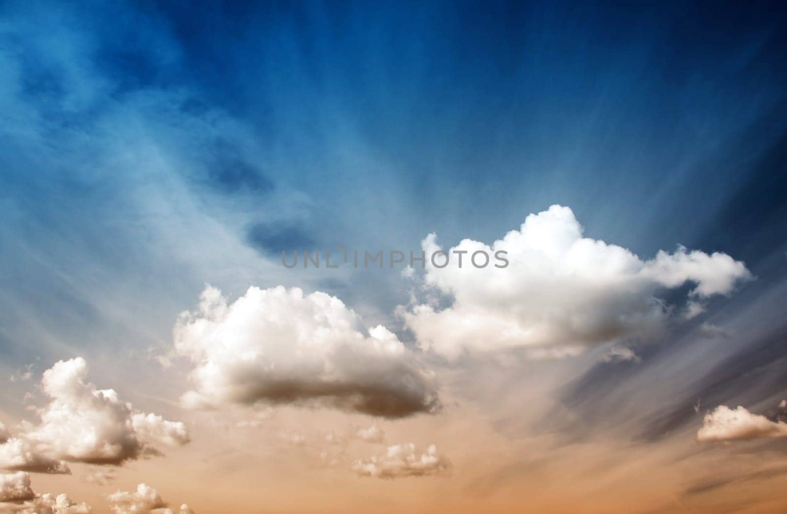 Fluffy clouds on the blue sky on sunny day