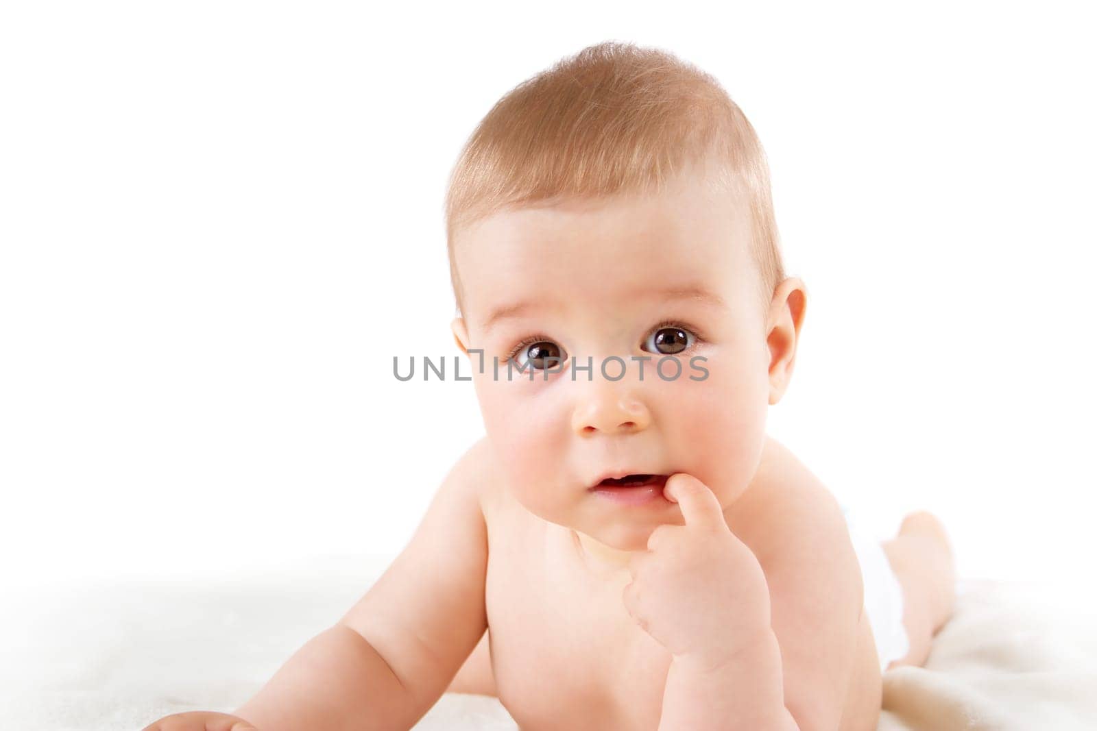 little baby isolated on white background lying on soft blanket
