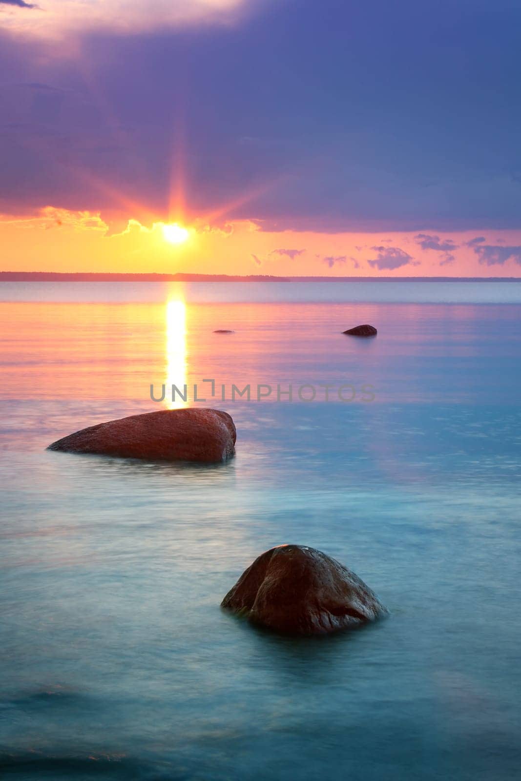 sunset at the sea with beautiful orange water and clouds