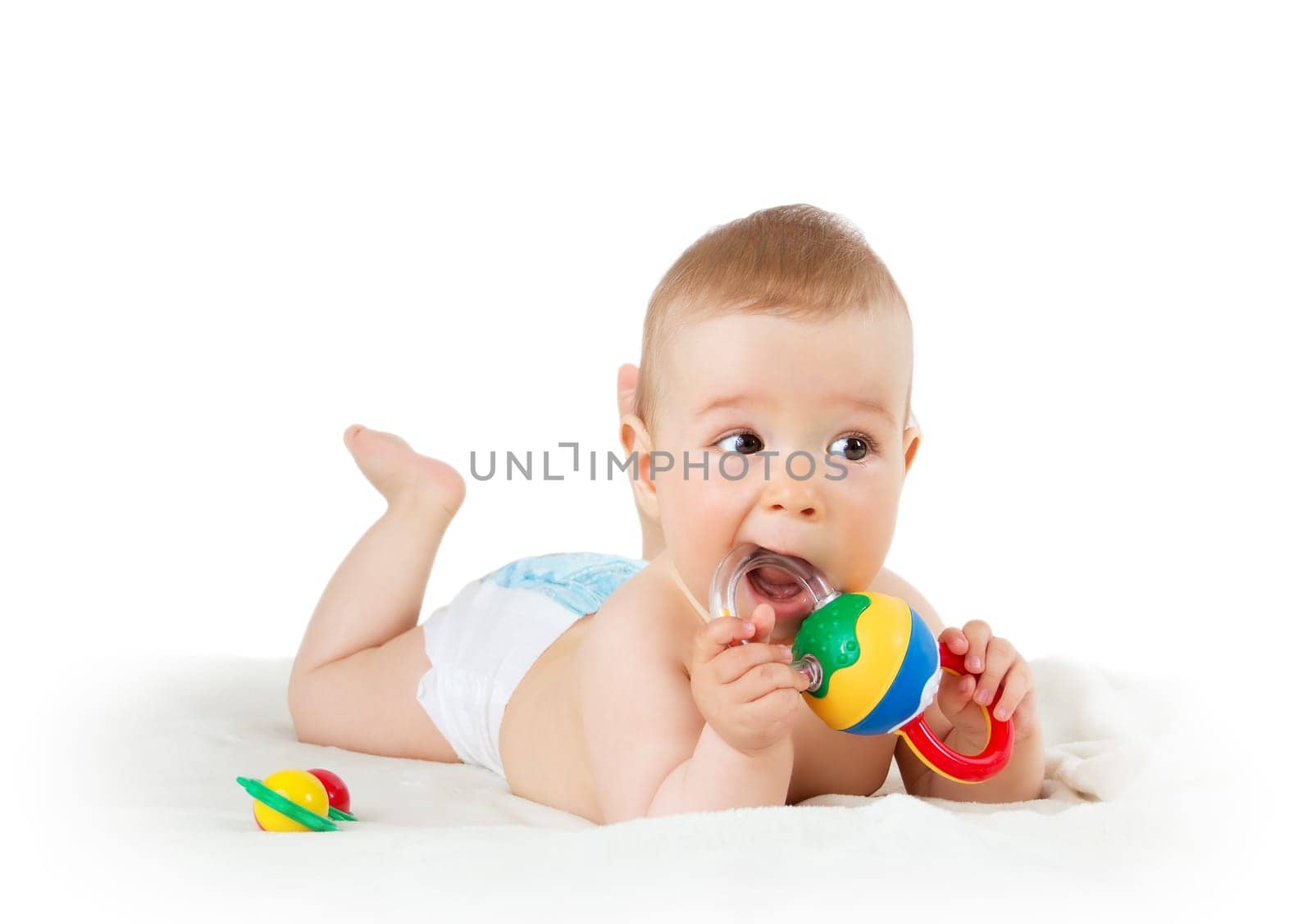 Baby holding a toy isolated on white background