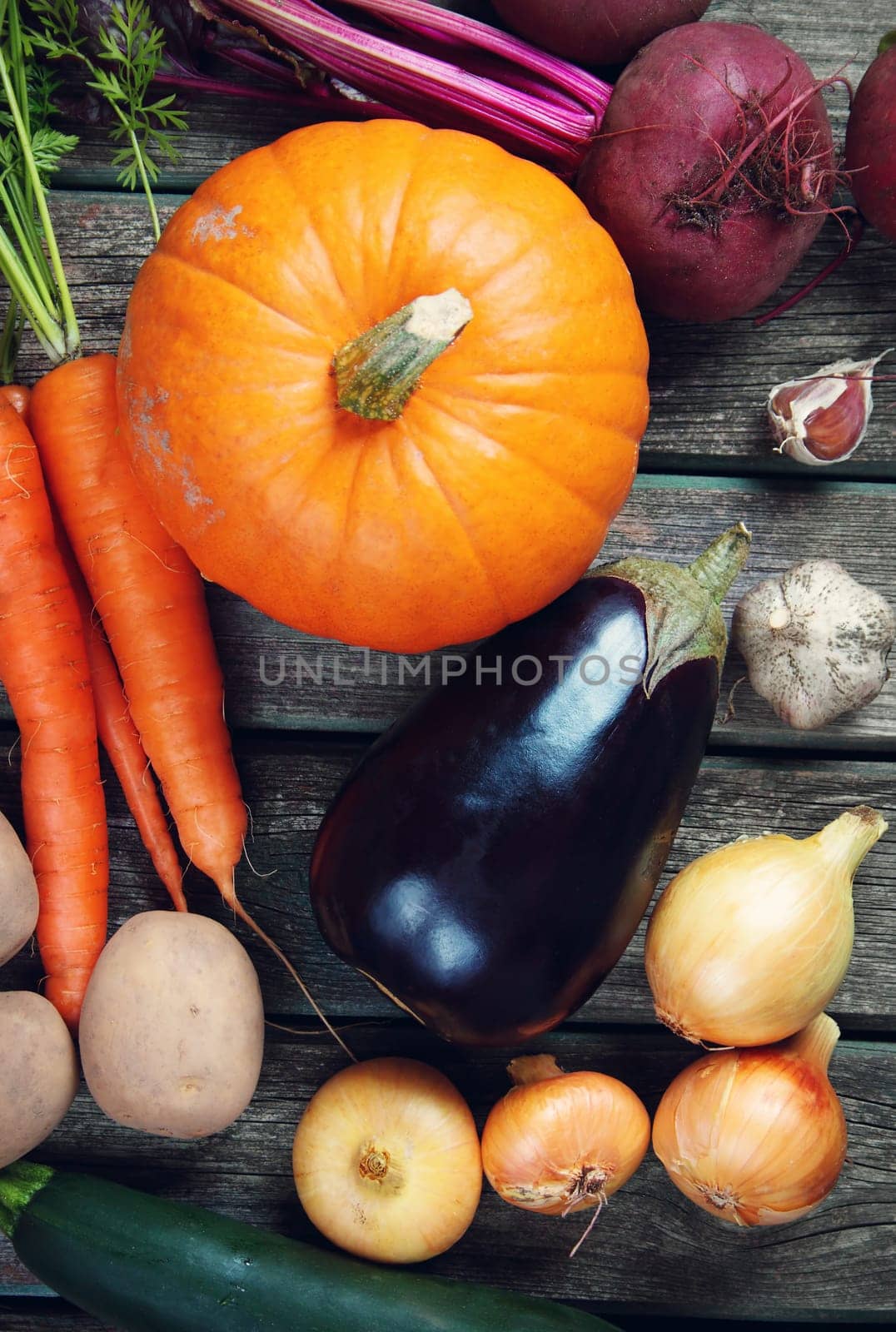 mixed vegetables on old weathered wooden background