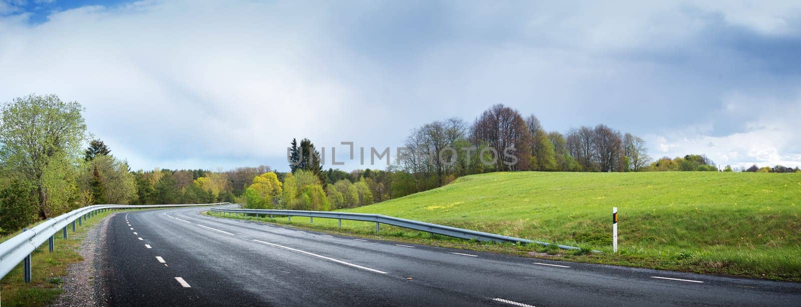 wet road panorama with beautiful clouds in the sky