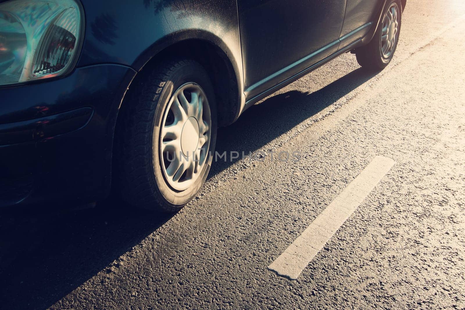 car tires on asphalt road with a dividing line