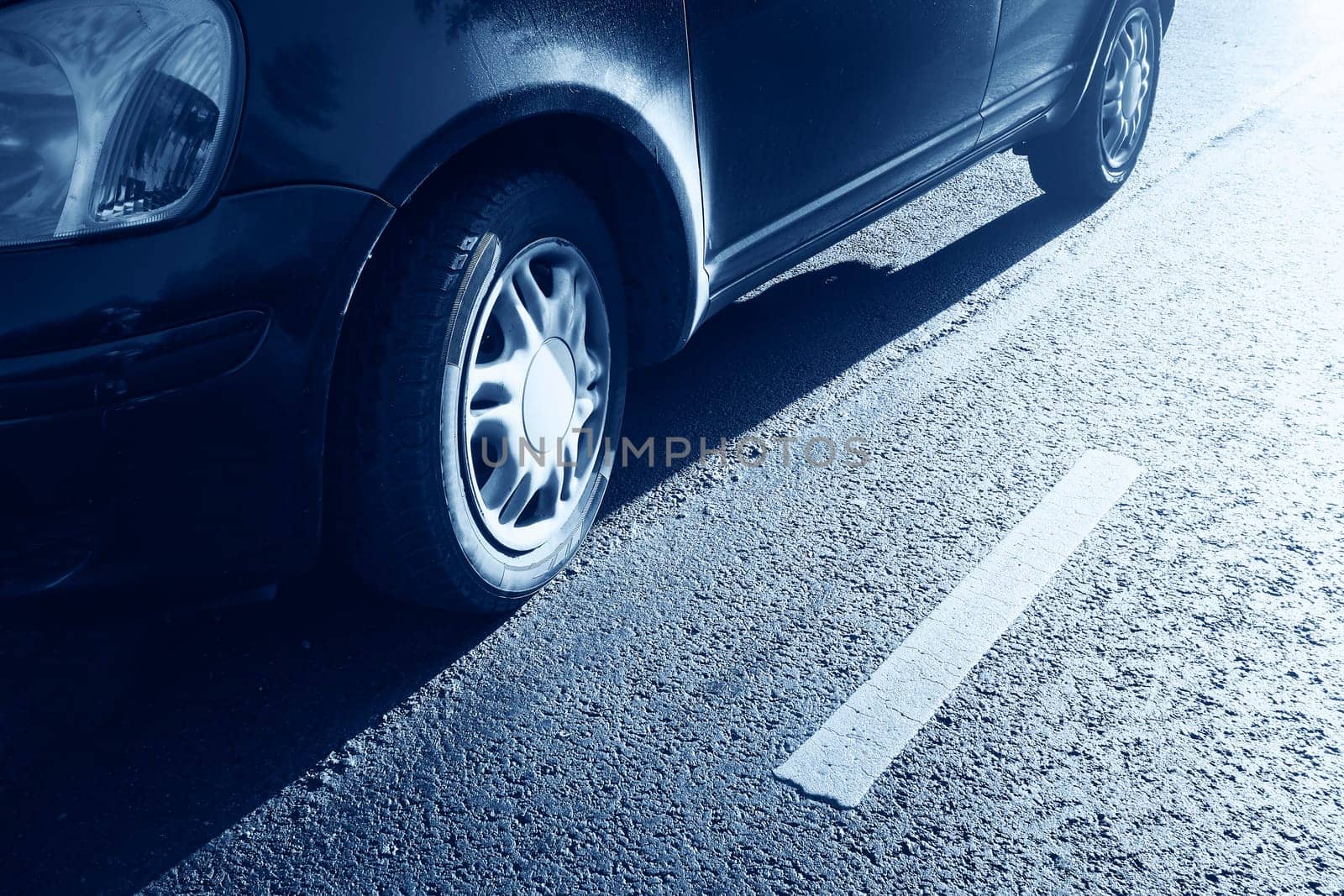 car tires on asphalt road with a dividing line