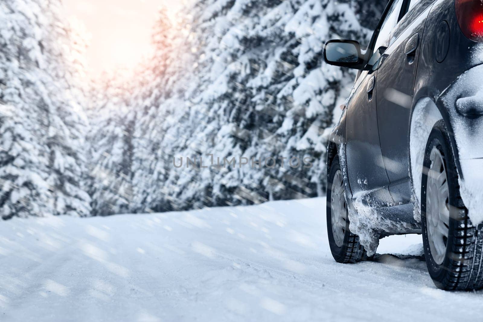 car on winter road in the morning