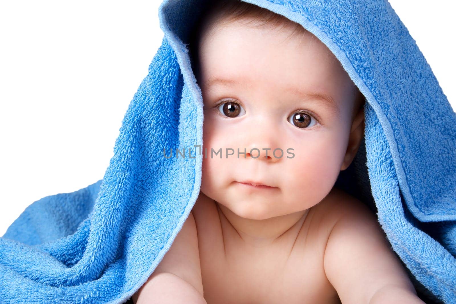 Cute eight month old baby wrapped in a towel isolated on white background