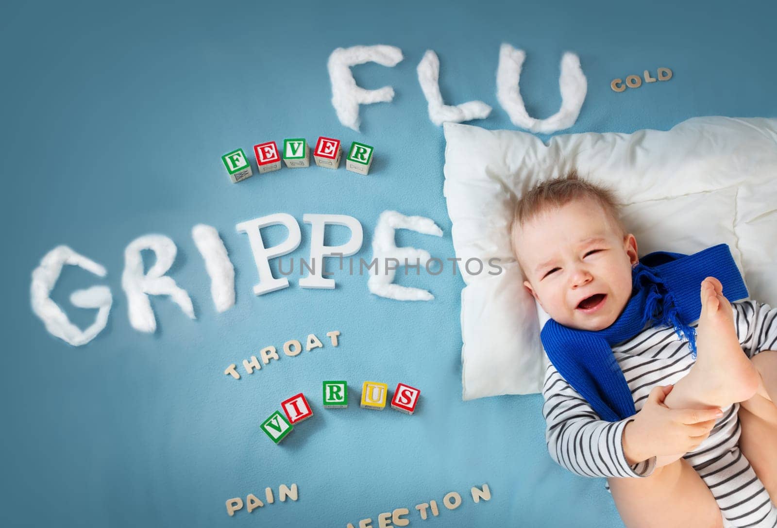 Ill boy lying in bed. baby with grippe text