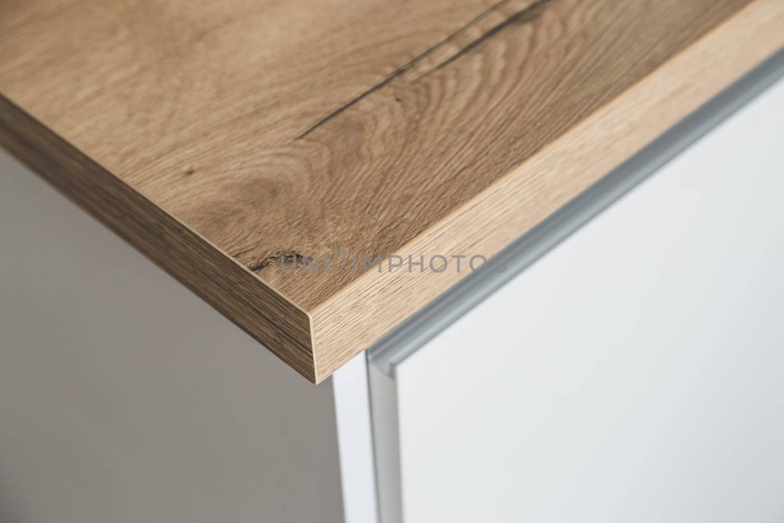 Corner of a modern kitchen worktop in the interior of a white kitchen.