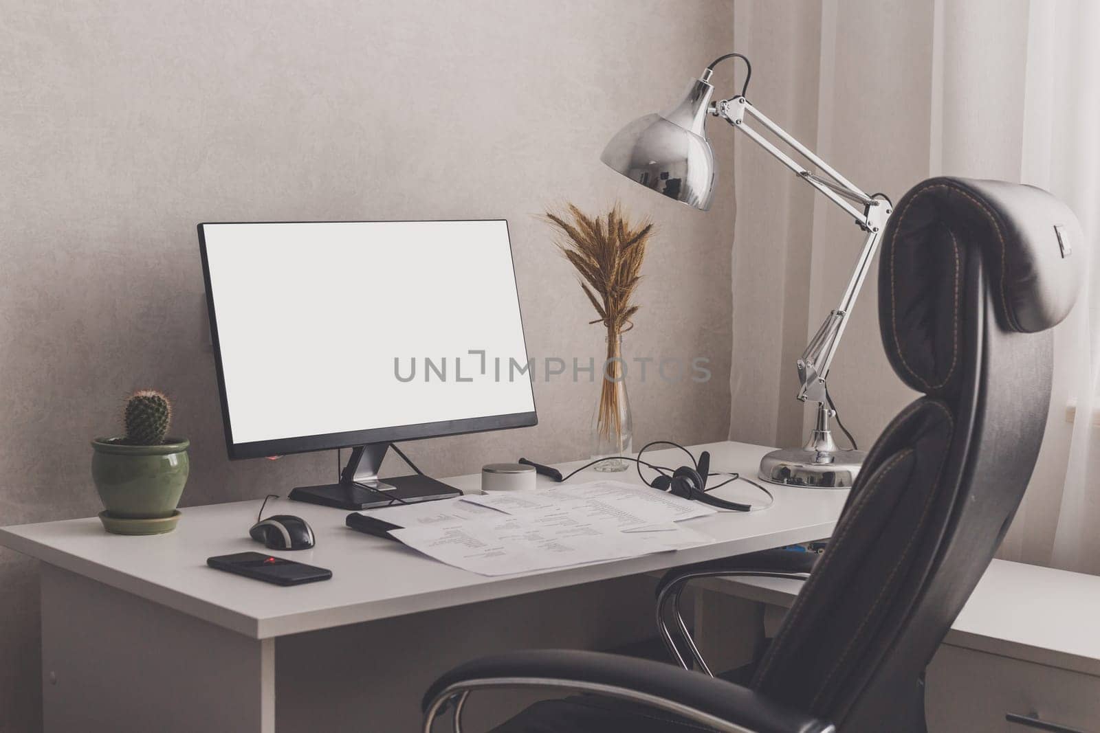 Modern stylish home office workplace. White, black and chrome colors. Blank screen for pasting image