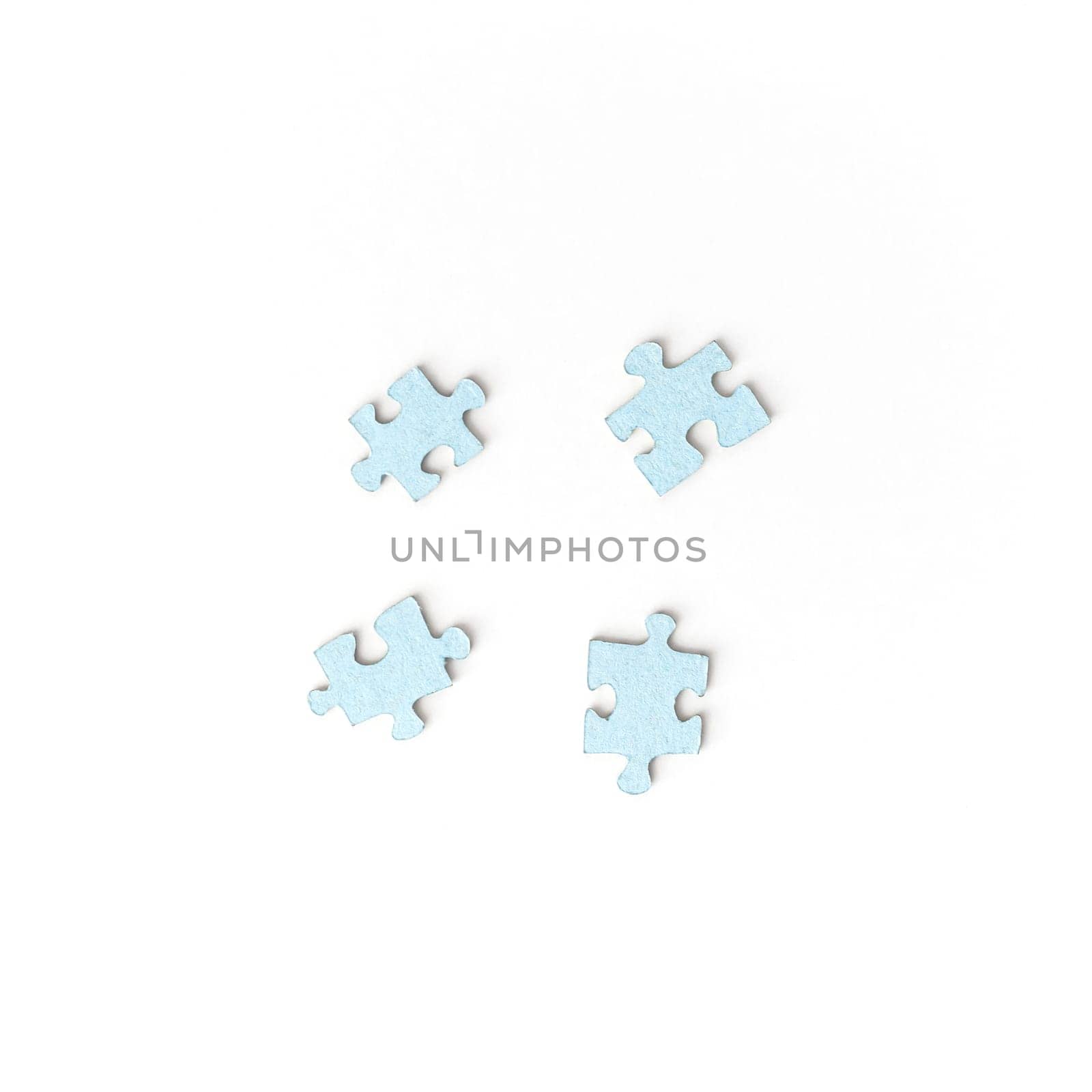 Unsuitable four puzzle pieces on white background. Top view. Unsolved problem concept
