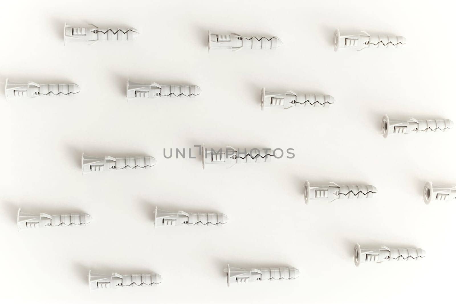 Plastic dowels isolated on white background. Flat lay, Seamless, endless backdrop