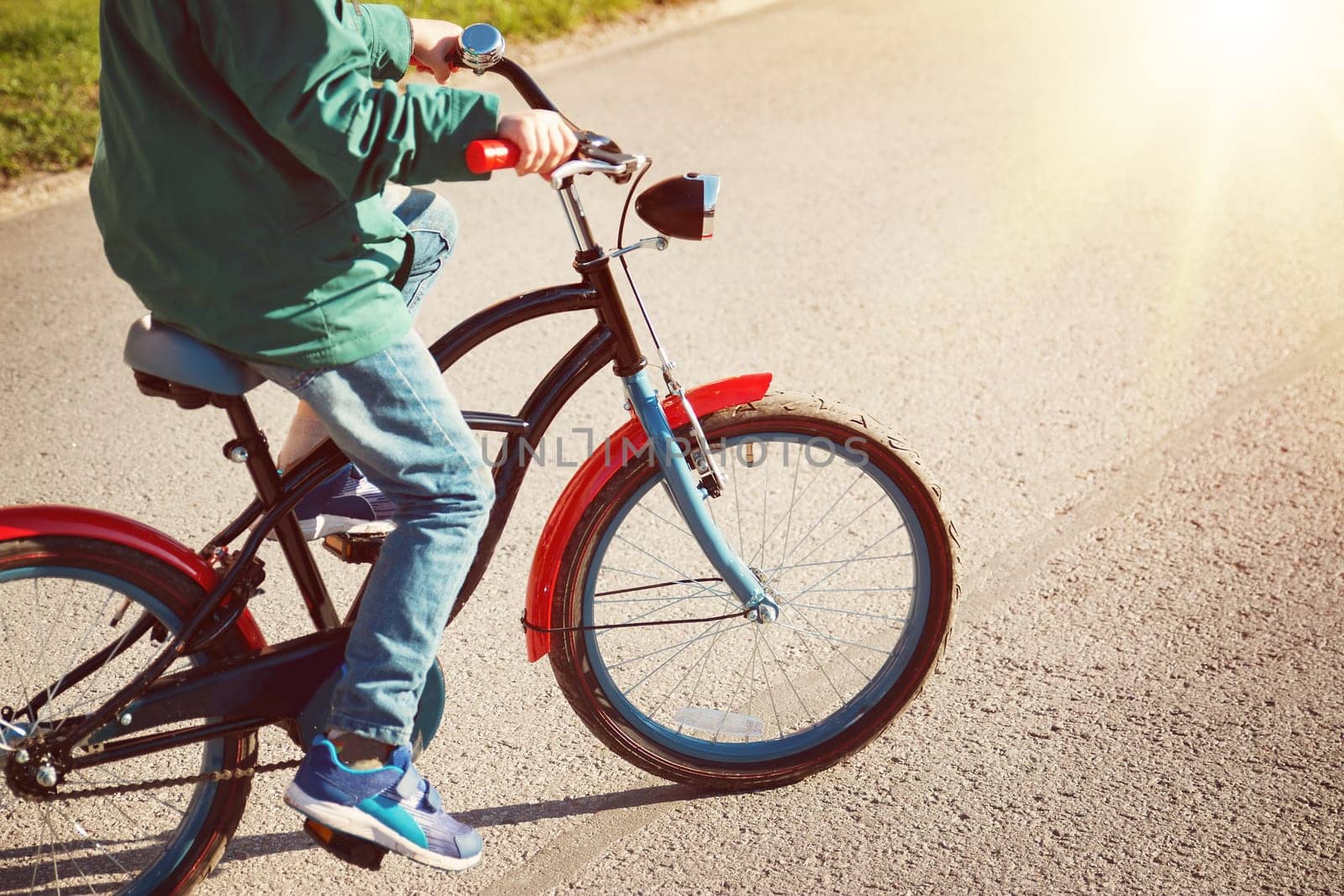 child on a bicycle at asphalt road