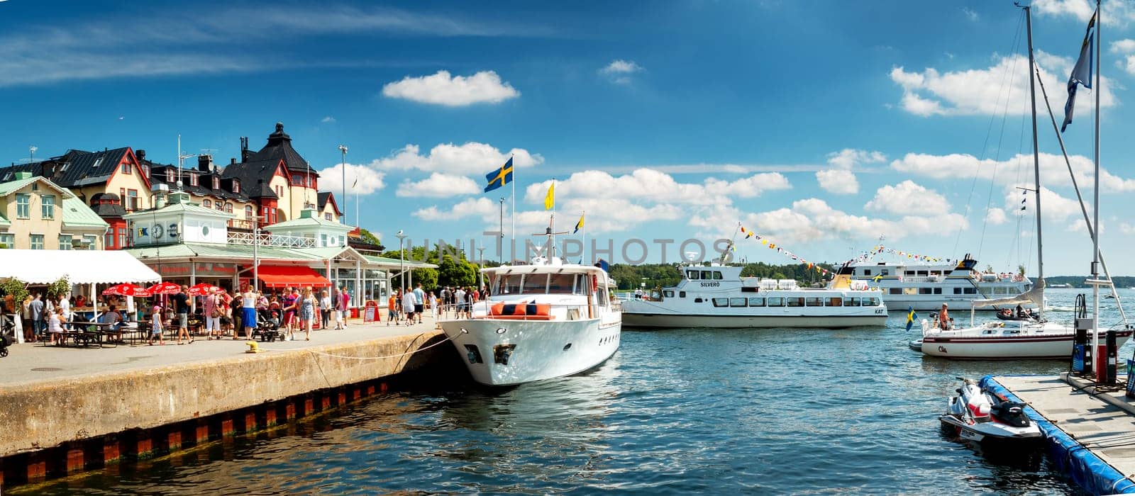 VAXHOLM, SWEDEN - JUNE 25, 2016: Cruise boats at little cosy island Vaxholm near Stockholm