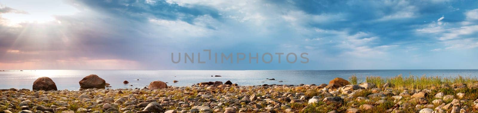 Rocky shores at the sea in sunset light. Lahemaa natural park coastal landscape with beautiful sky