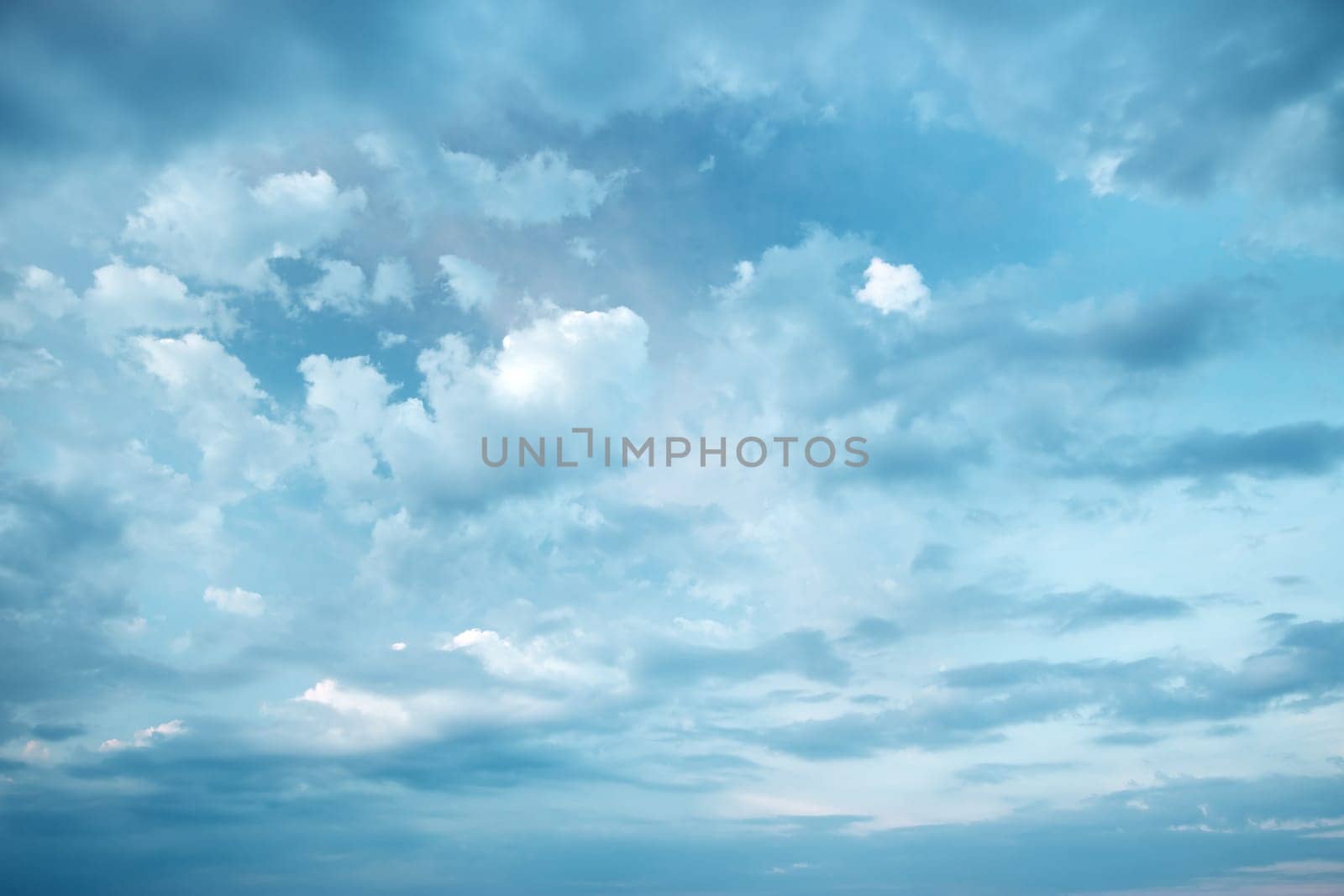 Dramatic clouds on the blue sky on sunny day
