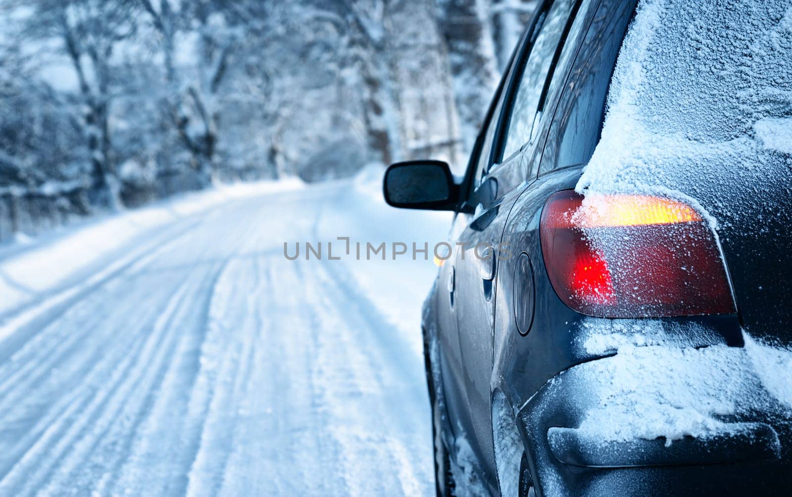 car on winter road in the morning