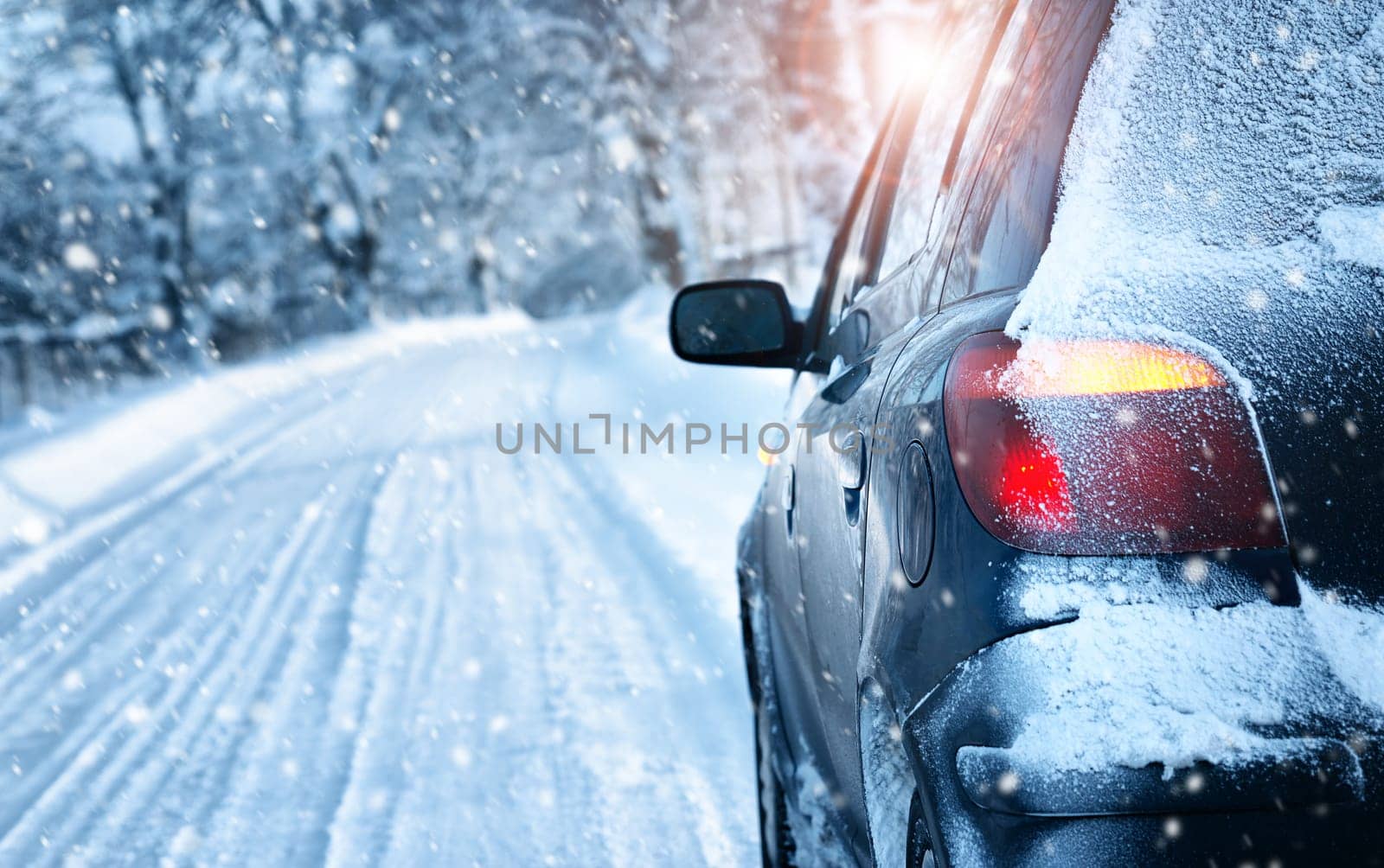 car on winter road in the morning