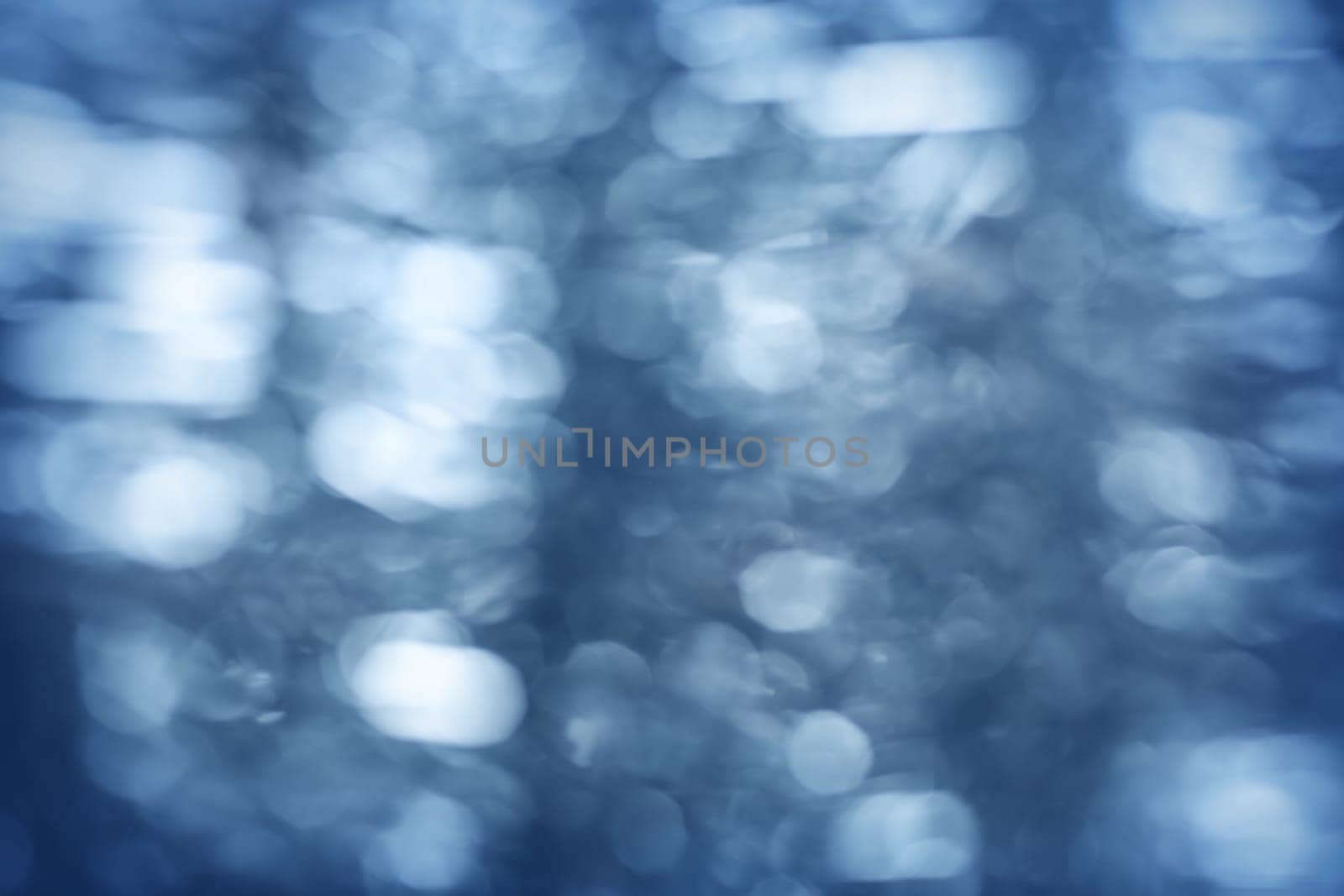 Blurred blue christmas background with beautiful bokeh