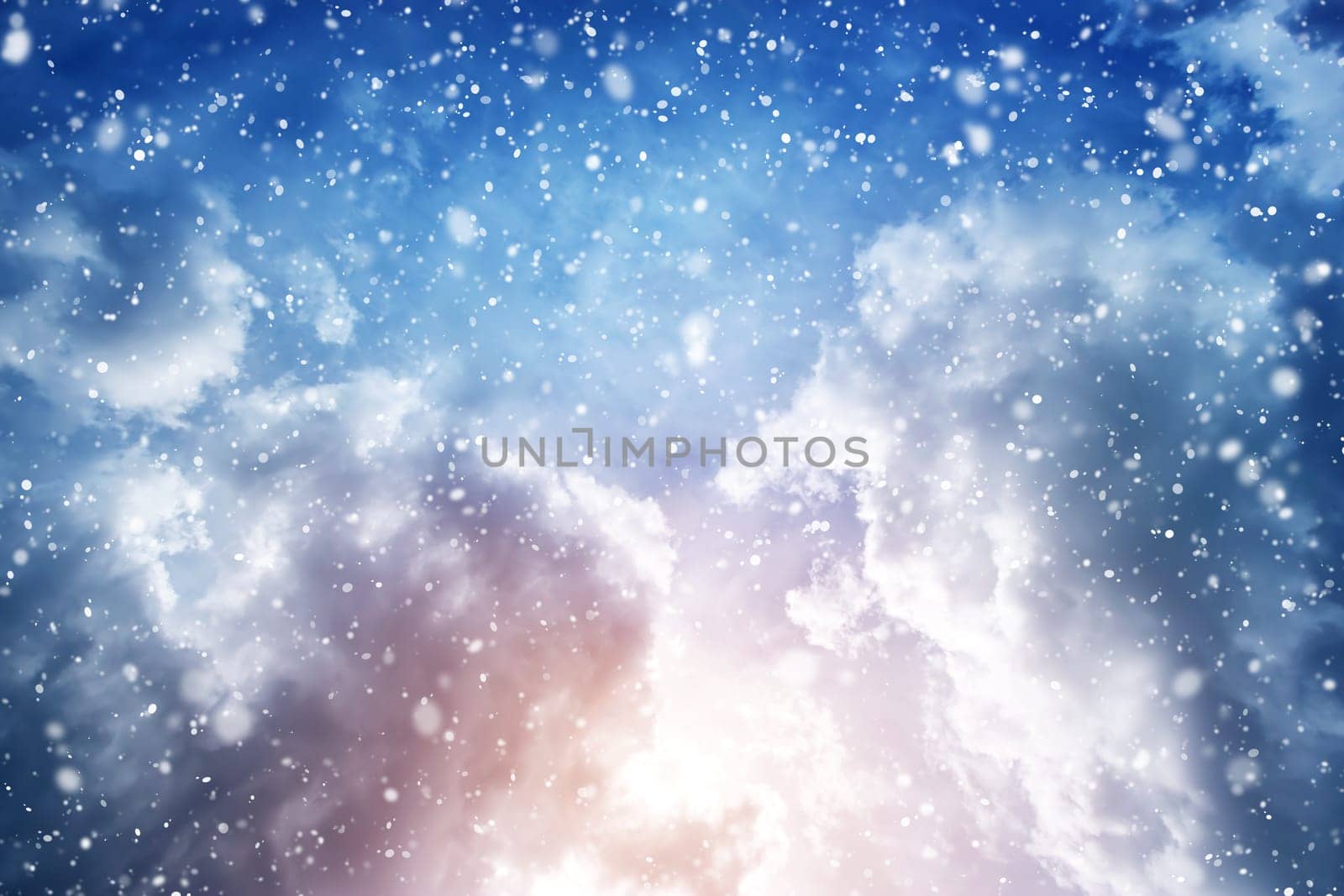 Dramatic clouds in late evening in winter with falling snow