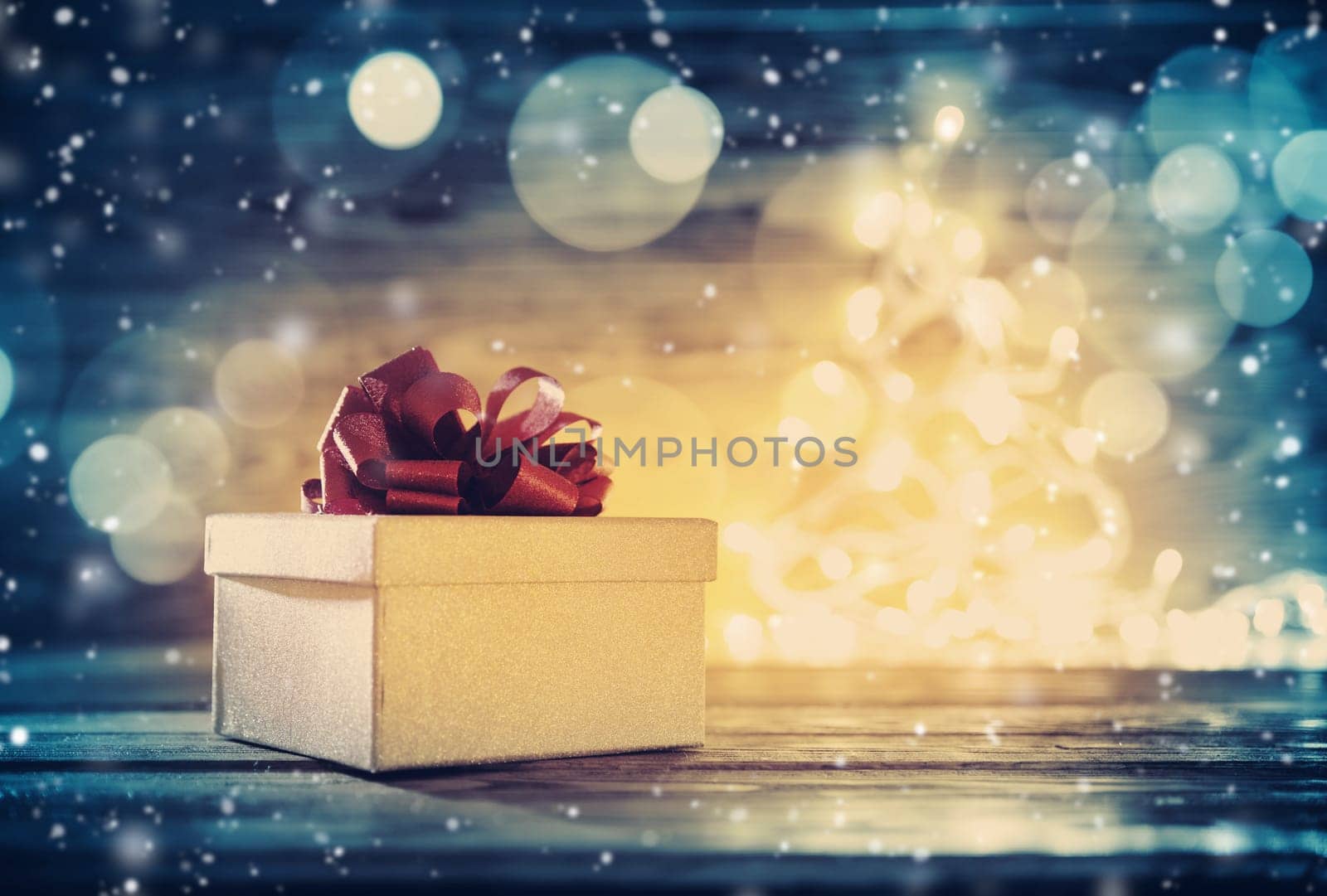 Old wooden planks with christmas decoration. Brown background with gift box