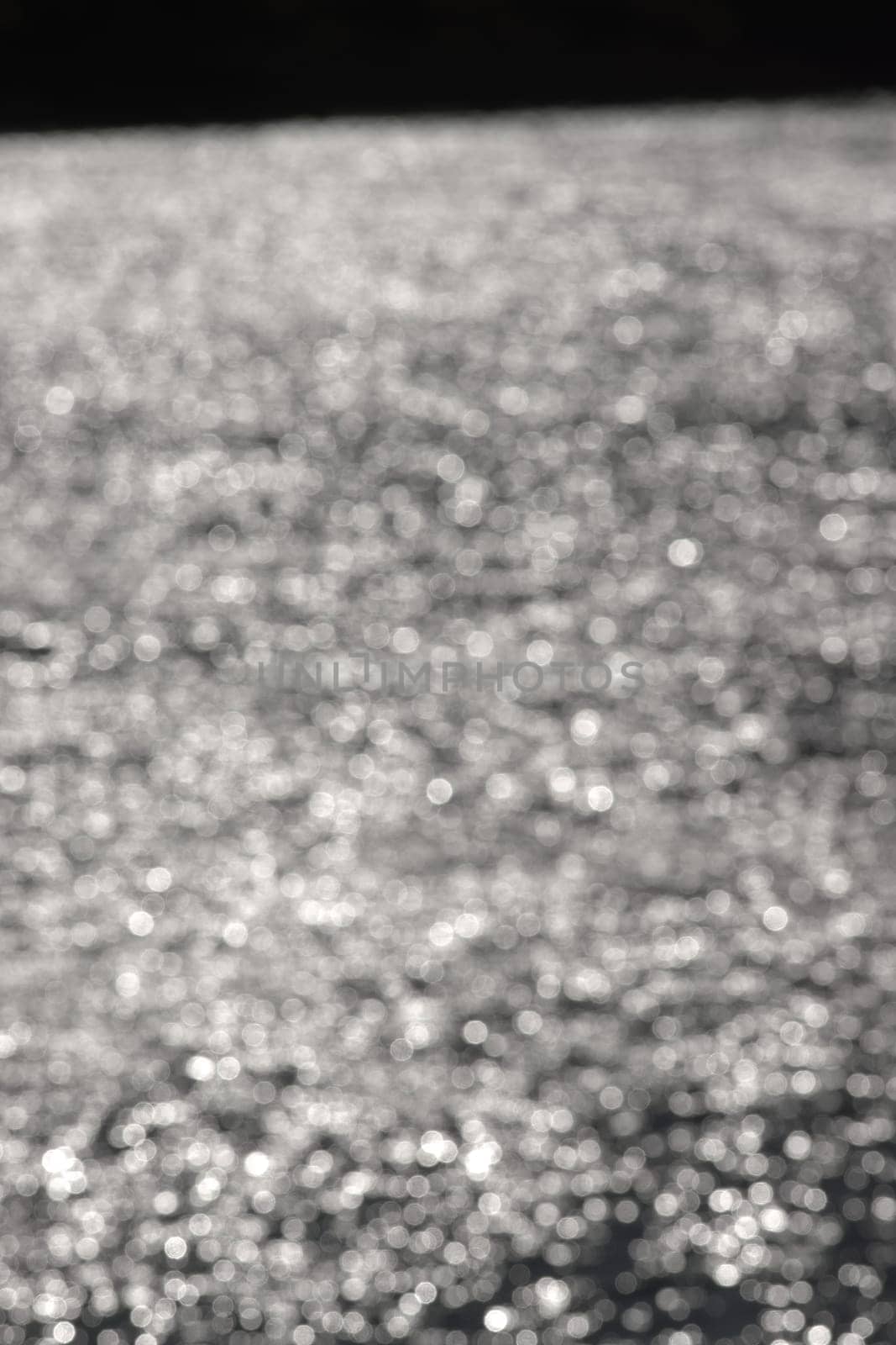 4 - Dense abstract textured bokeh background, vertical image, random bright white blurred pattern effect. outdoors inspiration, defocused technique