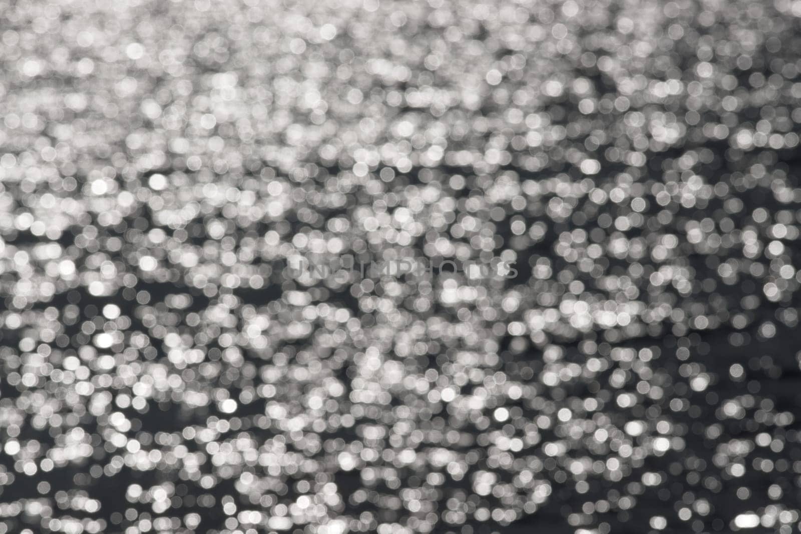2 - Full frame plain abstract textured water bokeh round circles background. Random pattern effect of white circles on a dark grey background
