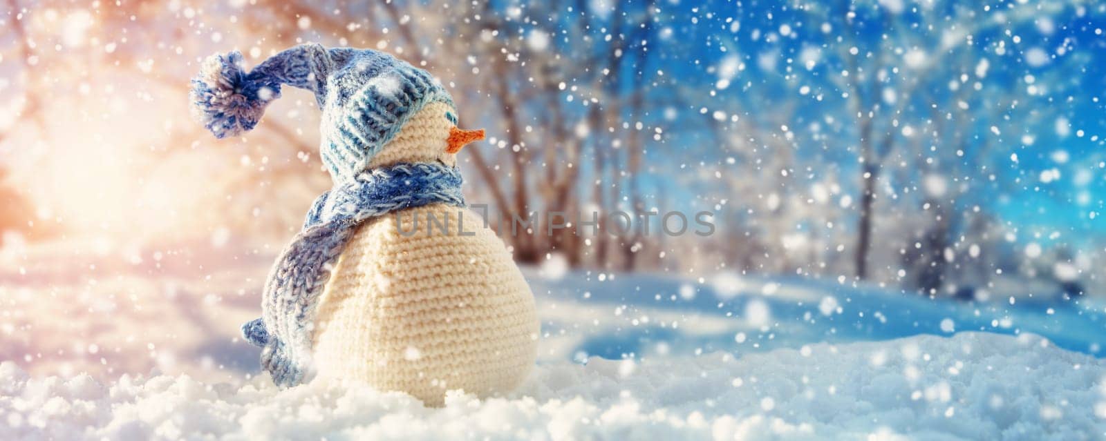 Branches covered with snow on blue sky background in winter