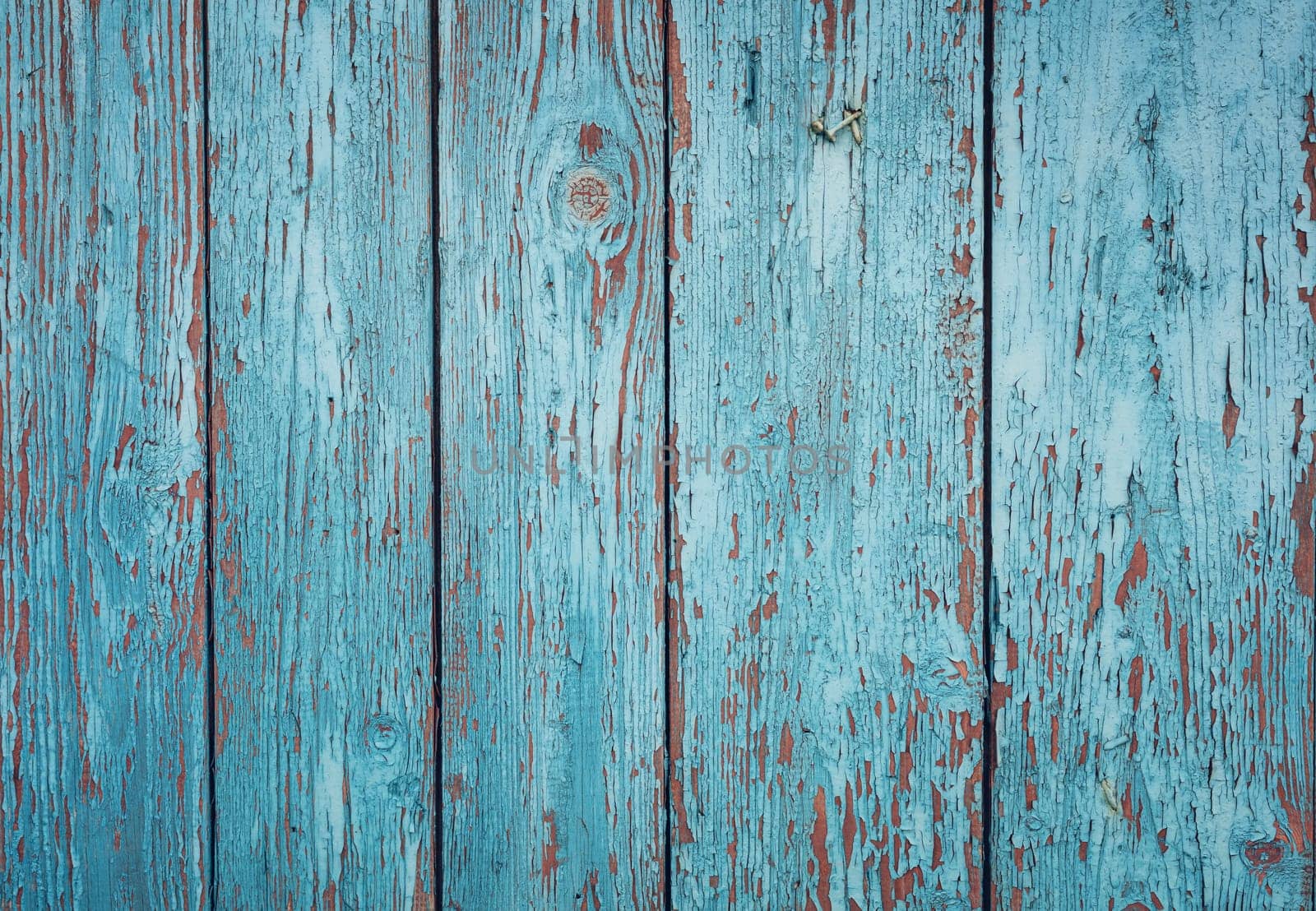 Old blue wooden planks. Rustic background with painted boards. Faded wall texture