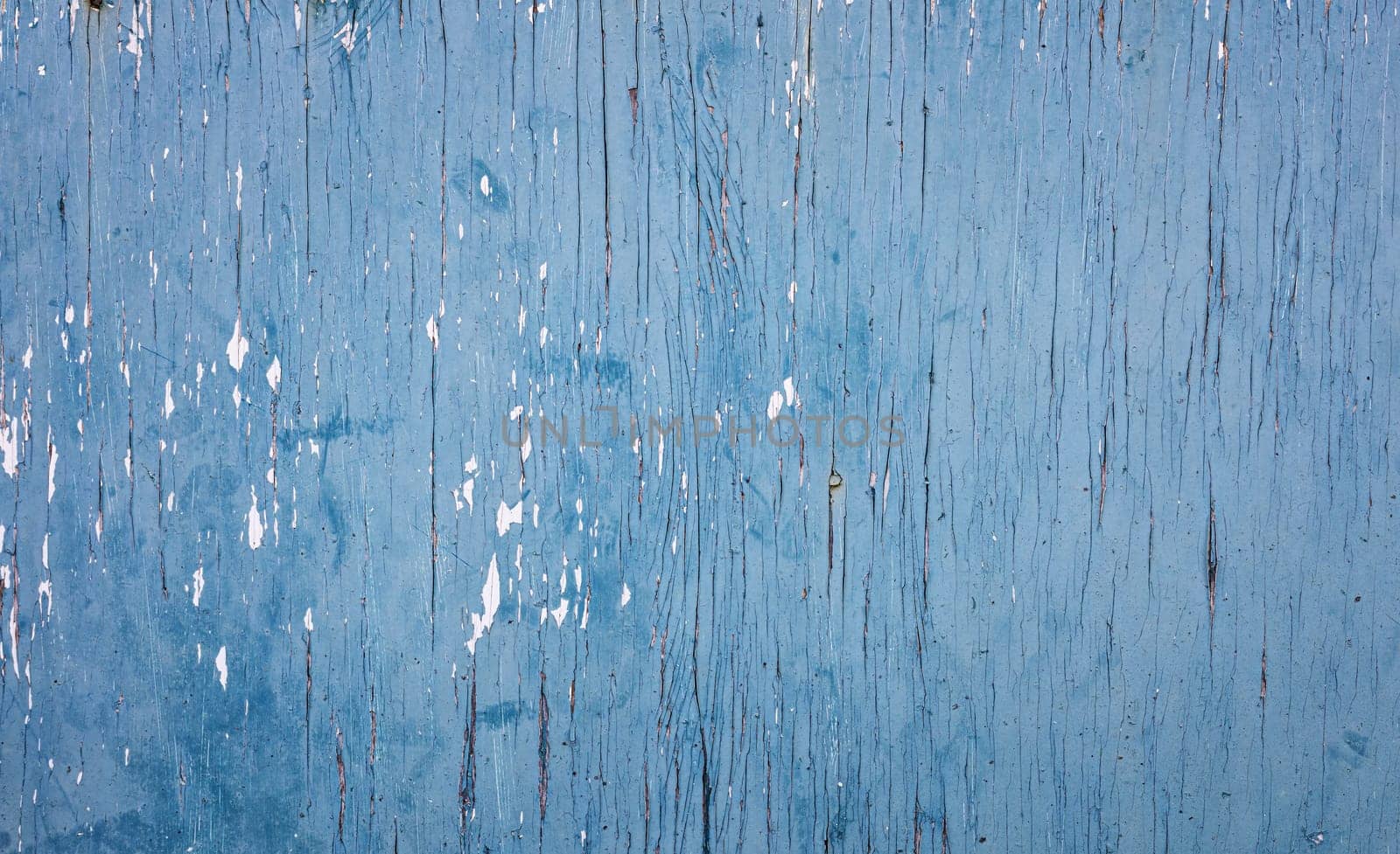 Old blue wooden planks. Rustic background with painted boards. Faded wall texture