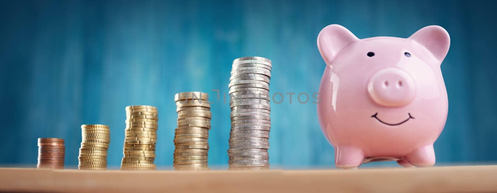 piggy bank with stacked coins. Pig with money savings on blue background