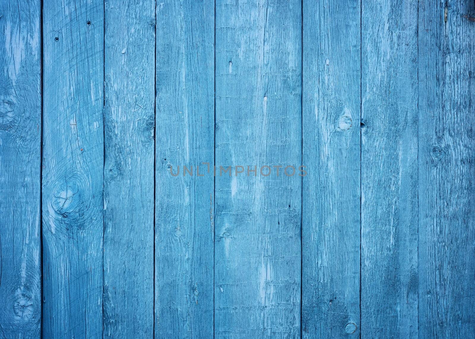 Old blue wooden planks. Rustic background with painted boards. Faded wall texture