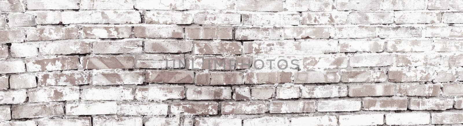 Rustic red brick background with white paint. Dirty wall pattern of an old building. Brickwall texture