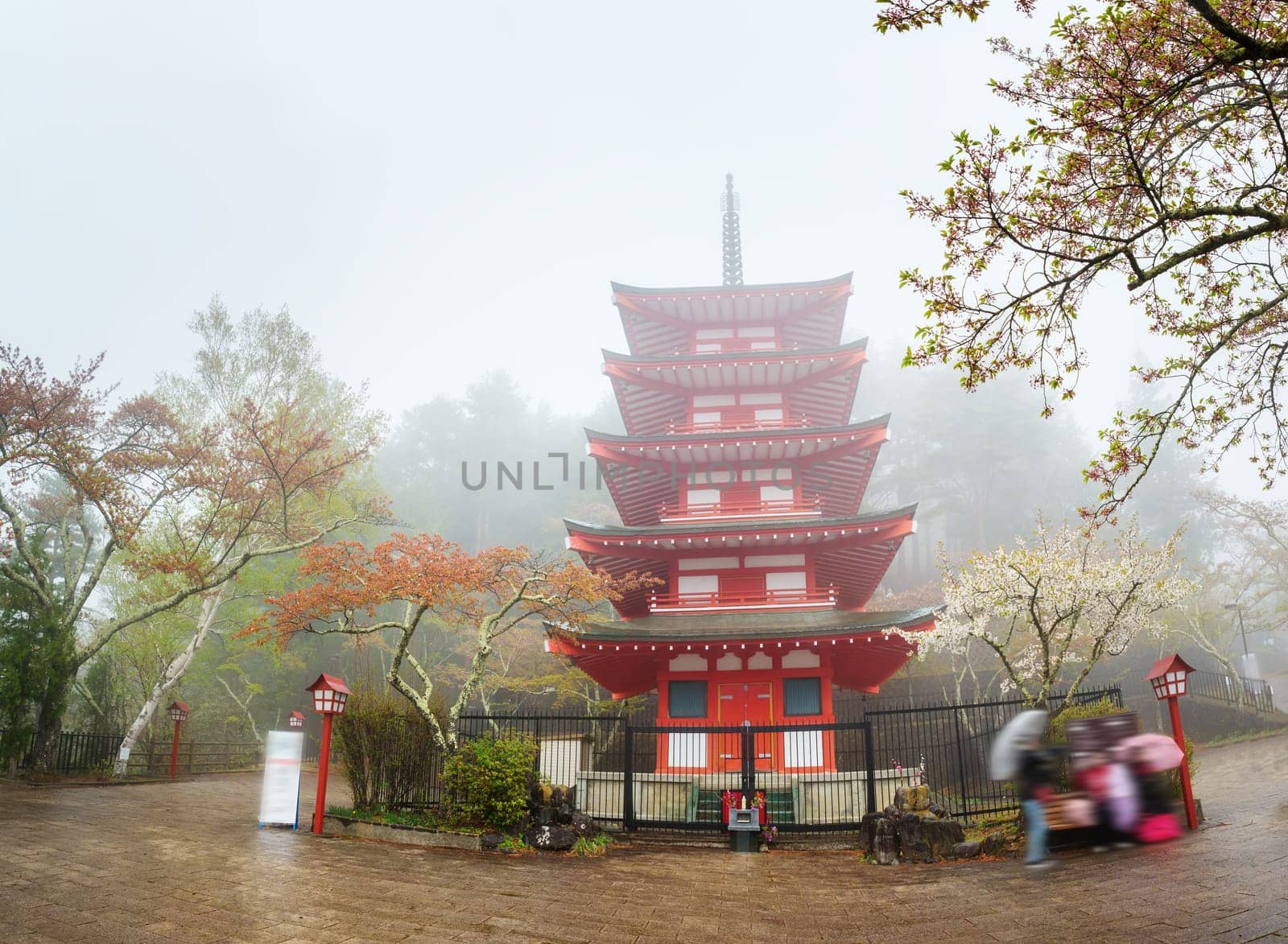 Chureito Pagoda near Fuji mountain at Fujiyoshida in Japan. Temple at Kawaguchiko in Arakura Sengen park on foggy day in spring with cherry blossoms