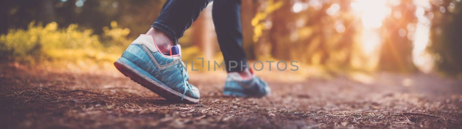 Young woman hiking and going camping in nature. Person with walking and running in the forest